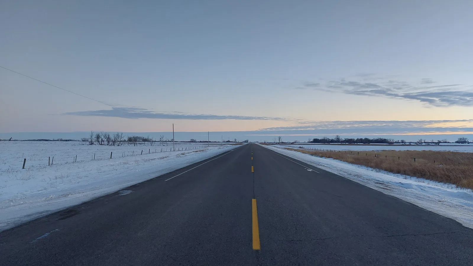 A two-lane rural Saskatchewan highway under an evening sky. File photo: generic highway, not the scene of the incident.